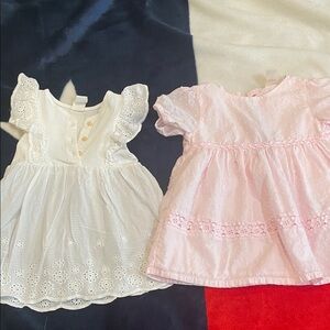 2 casual Dresses 12 months size one is H&M White and baby B’gosh Pink